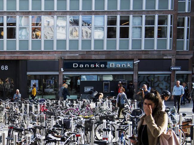 © Bloomberg. Bicycles stand in a parking space outside a Danske Bank A/S bank branch in central Copenhagen, Denmark, on Wednesday, Sept. 19, 2018.  Photographer: Freya Ingrid Morales/Bloomberg