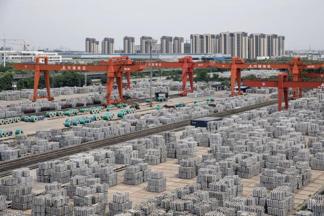 © Bloomberg. Bundles of aluminum ingots sit stacked at a China National Materials Storage and Transportation Corp. stockyard in Wuxi, China, on Wednesday, May 8, 2019. An unexpected fall in China’s exports and an equally unforeseen rise in imports show that the world’s second-largest economy continues a tentative recovery while global demand weakens and trade tensions re-escalate. 
