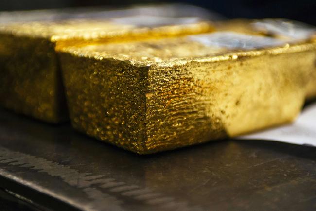 © Bloomberg. Gold bullion bars sit following casting at the Rand Refinery Ltd. plant in Germiston, South Africa, on Wednesday, Aug. 16. 2017. Established by the Chamber of Mines of South Africa in 1920, Rand Refinery is the largest integrated single-site precious metals refining and smelting complex in the world, according to their website.