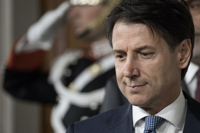 © Bloomberg. Giuseppe Conte, premier-designate, arrives to speak at a news conference following a meeting with Italy's President Sergio Mattarella at the Quirinale Palace in Rome, Italy, on Wednesday, May 23, 2018. Mattarella asked Conte, a law professor backed by a populist coalition but with no political experience, to form a government whose policy agenda has already alarmed markets. 