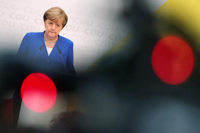 © Bloomberg. Angela Merkel, Germany's chancellor and Christian Democratic Union (CDU) leader, pauses during a news conference at the party's headquarters in Berlin, Germany, on Monday, Oct. 16, 2017. Merkel heads into potentially laborious talks this week to form a national government weakened after her Christian Democratic Union suffered a defeat in Volkswagen AG’s home state.