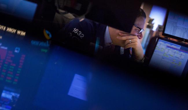 © Bloomberg. A trader works on the floor of the New York Stock Exchange (NYSE) in New York, U.S., on Monday, Jan. 29, 2018..