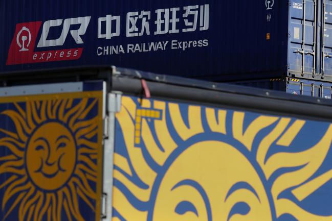 © Bloomberg. A China Railway Express Co. Ltd. shipping container sits stacked beyond a Waberer's International cargo truck trailer at Duisport shipping port in Duisburg, Germany, on Tuesday, Sept. 11, 2018.  Photographer: Krisztian Bocsi/Bloomberg