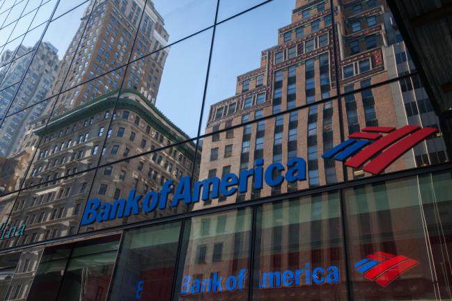 © Bloomberg. Building are seen reflected on the exterior of a Bank of America Corp. branch in New York, U.S. Photographer: Daniel Tepper/Bloomberg