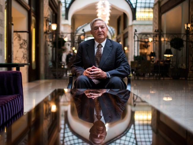 © Bloomberg. George Soros, founder of Soros Fund Management LLC, poses for a photograph following a Bloomberg Television interview in Budapest, Hungary, on Thursday, Sept. 13, 2012.