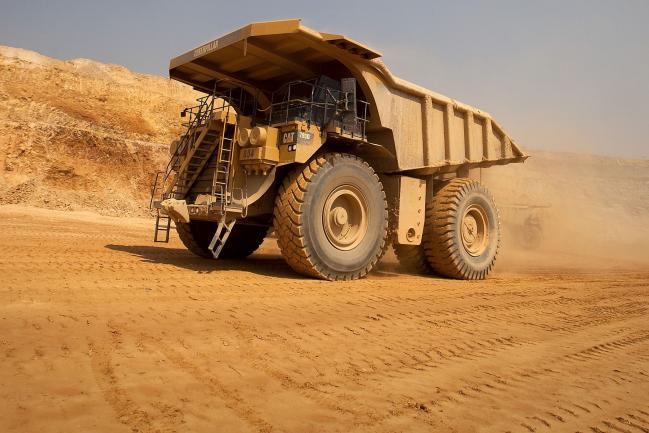 © Bloomberg. A Caterpillar Inc. mining truck leaves for the processing plant after collecting newly-excavated ore from the open pit at Katanga Mining Ltd.\\'s KOV copper and cobalt mine in Kolwezi, Katanga province, Democratic Republic of Congo, on Wednesday, Aug. 1, 2012. Israeli billionaire Dan Gertler, whose grandfather co-founded Israel\\'s diamond exchange in 1947, arrived in Congo in 1997 seeking rough diamonds. Since those early days, Gertler has invested in iron ore, gold, cobalt and copper as well as agriculture, oil and banking.