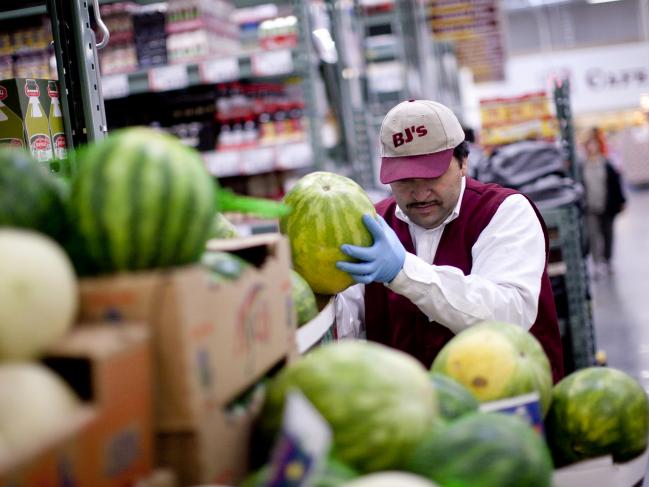 © Bloomberg. A worker arranges watermelons inside a BJ's Wholesale Club store in Falls Church, Virginia, U.S., on Thursday, Dec. 30, 2010. Photographer: Andrew Harrer/Bloomberg