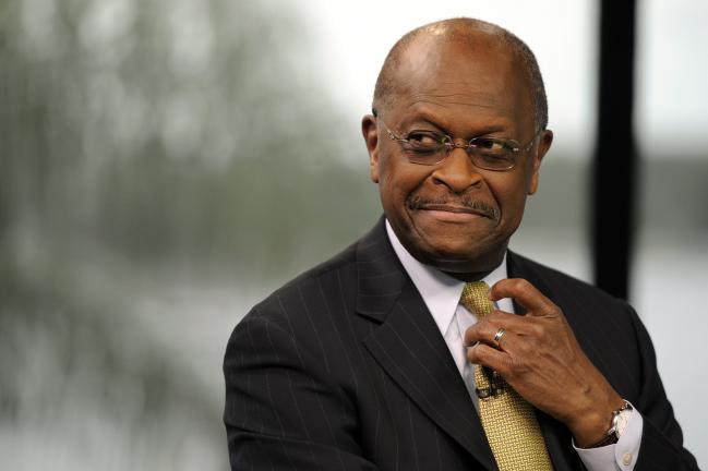 © Bloomberg. Herman Cain, former chairman and chief executive officer of Godfather's Pizza, listens during a Bloomberg Television interview inside the Bloomberg Link during the Republican National Convention in Tampa, Florida, U.S., on Wednesday Aug. 29, 2012. Representative Paul Ryan takes the stage tonight to address the RNC with a dual mission: to provide a spark, along with his big ideas about cutting the budget, to energize the party's base. Photographer: David Paul Morris/Bloomberg *** Local Caption *** Herman Cain