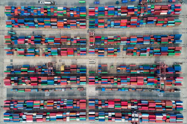 © Bloomberg. Shipping containers sit stacked in this aerial photograph taken above the Busan Port Terminal (BPT) in Busan, South Korea. 