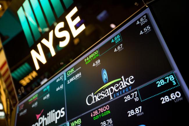 © Bloomberg. A monitor displays Chesapeake Energy Corp. signage on the floor of the New York Stock Exchange (NYSE) in New York. Photographer: Michael Nagle/Bloomberg