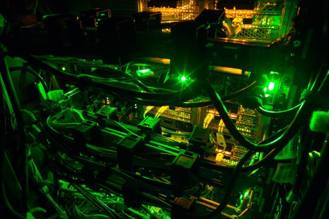 © Bloomberg. Green light illuminates data rack servers in the server room of the Sberbank PJSC data processing center (DPC) at the Skolkovo Innovation Center, in Moscow, Russia, on Tuesday, Dec. 26, 2017. Sberbank PJSC, Russia’s most valuable company, will boost its dividend payout to 50 percent of profit or higher, just not as quickly as some investors had hoped.