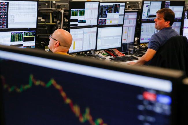 © Bloomberg. Traders monitor financial data on computer screens on the trading floor at ETX Capital, a broker of contracts-for-difference, following the results of the U.K. Parliament Brexit deal in London, U.K., on Tuesday, Jan. 15, 2019. U.K. Prime Minister Theresa May's Brexit deal was rejected by Parliament in a humiliating defeat, her plan for leaving the European Union all but dead. Photographer: Luke MacGregor/Bloomberg