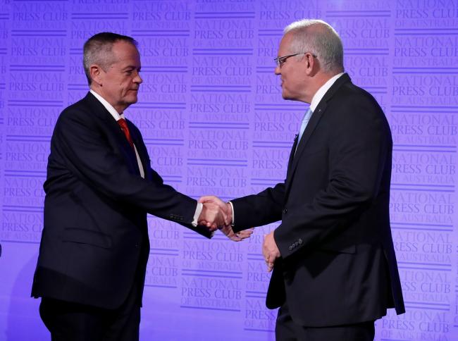 © Bloomberg. CANBERRA, AUSTRALIA - MAY 8: In this handout image provided by News Corp Australia, Prime Minister Scott Morrison and Labor leader Bill Shorten shake hands at the start of 