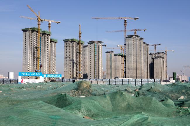 © Bloomberg. Buildings stand under construction in Shijingshan District in Beijing, China, on Thursday, Jan. 17, 2019. China is facing its most difficult economic environment in years. The world's second-biggest economy is in a trade standoff with the biggest -- the U.S. -- and under pressure from President Xi Jinping's 