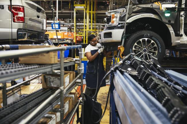 © Bloomberg. An employee works on the line at the Ford Motor Co. Dearborn Truck Plant in Dearborn, Michigan, U.S., on Thursday, Sept. 27, 2018. Ford Motor Co. is watching trade talks closely. With almost 40 percent of its revenue coming from outside North America and factories in Mexico and Canada, the second-largest U.S. automaker has a lot at stake in the outcomes of the Trump administration's myriad negotiations and tariff schemes. Photographer: Sean Proctor/Bloomberg