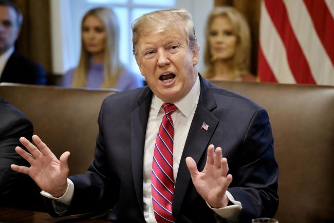 © Bloomberg. U.S. President Donald Trump speaks during a meeting in the Cabinet Room of the White House in Washington, D.C., U.S., on Tuesday, Feb. 12, 2019. Trump said he isn't happy with the deal on border-security funding Republican and Democratic negotiators worked out to avert another government shutdown, but he said he would hold a meeting later Tuesday to consider the compromise. 