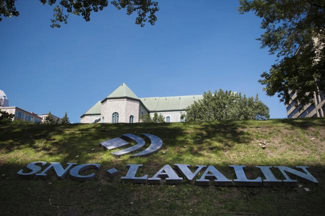 © Bloomberg. SNC-Lavalin Group Inc. signage is displayed in Montreal. 