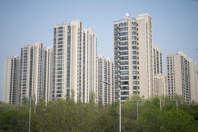 © Bloomberg. Residential buildings stand in the Taiyanggong area of Beijing, China, on Monday, April 16, 2018. New home prices in Beijing and Shanghai have jump more than 25 percent over the last two years. 