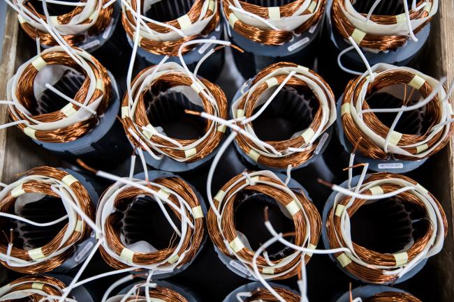 © Bloomberg. Copper wiring to be used in a pump assembly sits stacked inside the Grundfos AS factory in Tatabanya, Hungary, on Wednesday, June 7, 2017. A gauge of Hungary's manufacturing activity pointed to a record pace of expansion, boosted by output, new orders and higher employment, according to index publisher MLBKT.