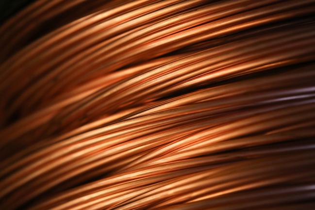 © Bloomberg. Copper wire rod sits in a storage facility following manufacture at the Uralelectromed OJSC Copper Refinery, operated by Ural Mining and Metallurgical Co. (UMMC), in Verkhnyaya Pyshma, Russia, on Tuesday, March 7, 2017. Russias No. 1 zinc miner and No. 2 copper producer plans a far-reaching expansion of its diversified minerals output, billionaire co-owner and Chief Executive Officer Andrey Kozitsyn said in an interview.