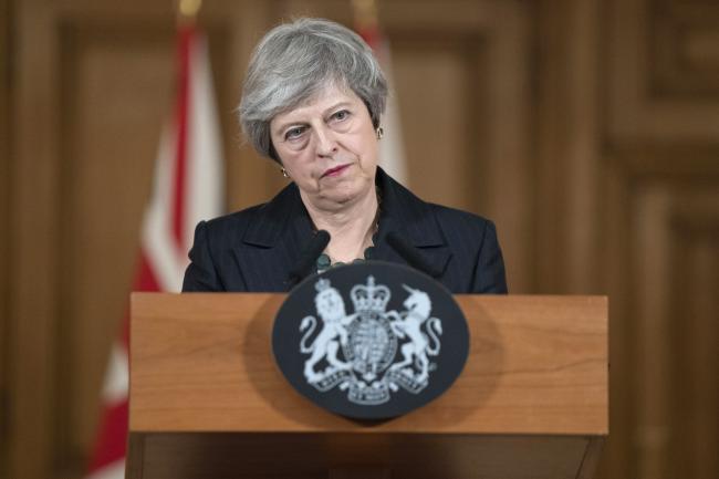 © Bloomberg. Theresa May, U.K. prime minister, listens to a question from reporters as she delivers a statement on the Brexit agreement during a news conference inside number 10 Downing Street in London, U.K., on Thursday, Nov. 15, 2018. As Brexit Secretary Dominic Raab resigned, May is fighting for her political life as a growing revolt from within her own party threatens to derail her Brexit plans and force the U.K. out of the European Union with no deal. Photographer: David Levenson/Bloomberg