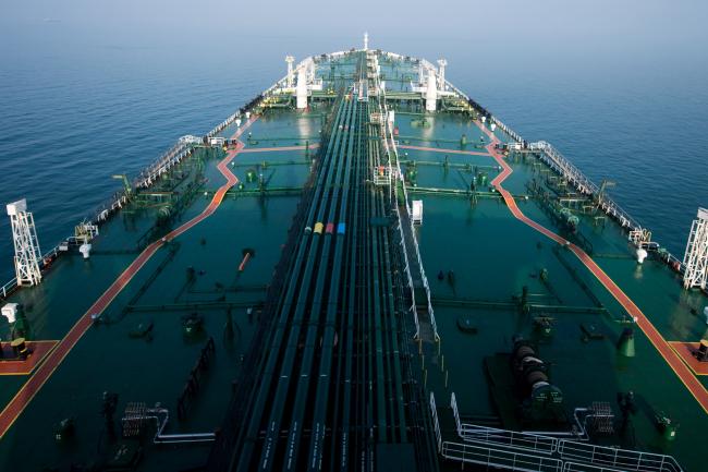 © Bloomberg. The crude oil tanker 'Devon' sails through the Persian Gulf towards Kharq Island to transport crude oil to export markets in the Persian Gulf, Iran, on Friday, March 23, 2018. Geopolitical risk is creeping back into the crude oil market. 