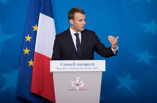 © Bloomberg. Emmanuel Macron, France's president, gestures while speaking during a news conference at a European Union (EU) leaders summit in Brussels, Belgium, on Friday, Oct. 20, 2017. U.K. Prime Minister Theresa May told European Union leaders they must take “urgent” steps to move Brexit talks forward, warning them that both sides need a deal they can sell to their own people. 