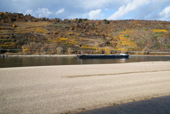 &copy Bloomberg. OBERWESEL, GERMANY - NOVEMBER 13: Half loaded cargo ships pass banks and the low water in the River Rhine along the vineyards on November 13, 2018 in Oberwesel, Germany. Summer heat wave in Germany as well unfavorable wind conditions, and no rain left Rhine River - which begins in the Swiss Alps, runs through Germany, and empties into the North Sea - at record low water levels. Making problems in shipping industry, brought environmental damage, prices of oil to rise and billions of euros of losses. Although rainfall is expected soon, experts warn it will probably take weeks or months to bring water levels in Germany's most important waterway and a key shipping route for the Netherlands and France back to normality. (Photo by Andreas Rentz/Getty Images)