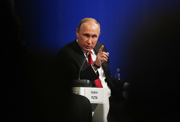 © Bloomberg. Vladimir Putin, Russia's president, gestures as he speaks at the plenary session during the St. Petersburg International Economic Forum (SPIEF) at the Expoforum in Saint Petersburg, Russia, on Friday, June 2, 2017. The event program is based around the theme 'Achieving a New Balance in the Global Economic Arena' and runs from June 1 - 3.