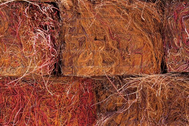 © Bloomberg. Pressed cubes of copper scrap sit ahead of recycling at the Aurubis AG metals plant in Hamburg, Germany.