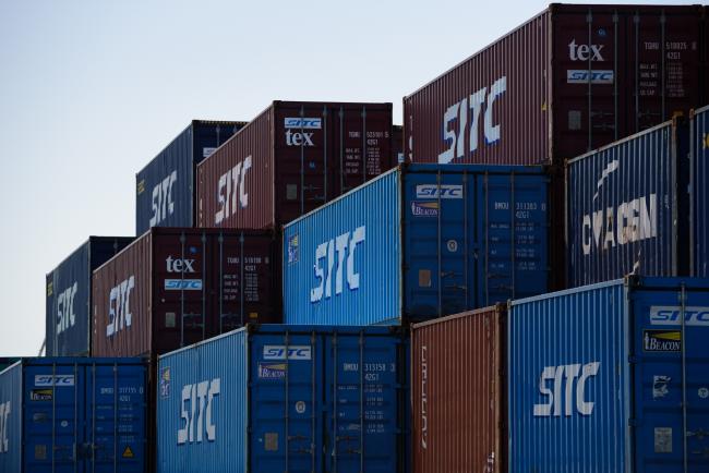 © Bloomberg. SITC International Holdings Co. containers sit stacked at a shipping terminal in Yokohama, Japan, on Monday, April 16, 2018. Japan and China held their first high-level economic dialogue in almost eight years on April 16 against a backdrop of trade threats from the U.S. Photographer: Akio Kon/Bloomberg