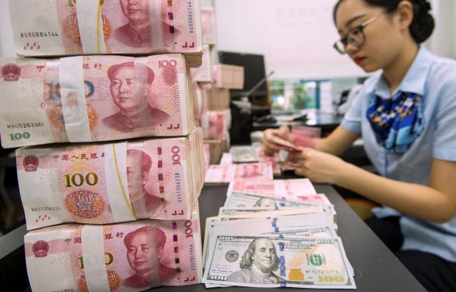 Trump’s Trade War Pits Mnuchin Against IMF Over China’s Yuan