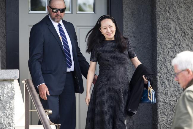 © Bloomberg. Meng Wanzhou leaves her house in Vancouver on May 8. Photographer: Jimmy Jeong/Bloomberg