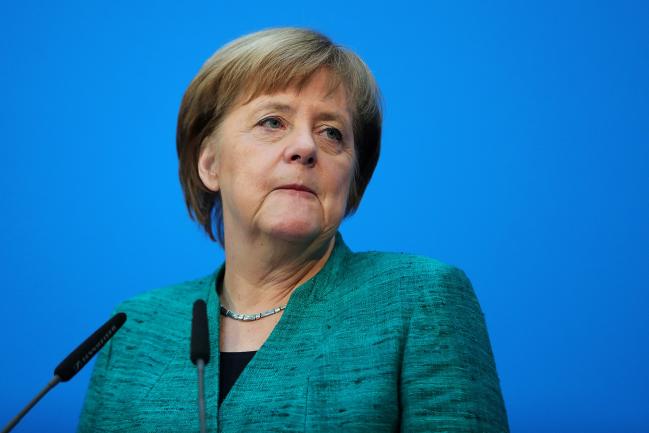 © Bloomberg. Angela Merkel, Germany's chancellor and leader of the Christian Democratic Union (CDU) party, pauses during a news conference at the CDU headquarters in Berlin, Germany, on Wednesday, Feb. 7, 2018. Merkel’s bloc has concluded a coalition agreement with the Social Democratic Party, ending a four-month political stalemate in Europe’s largest economy.