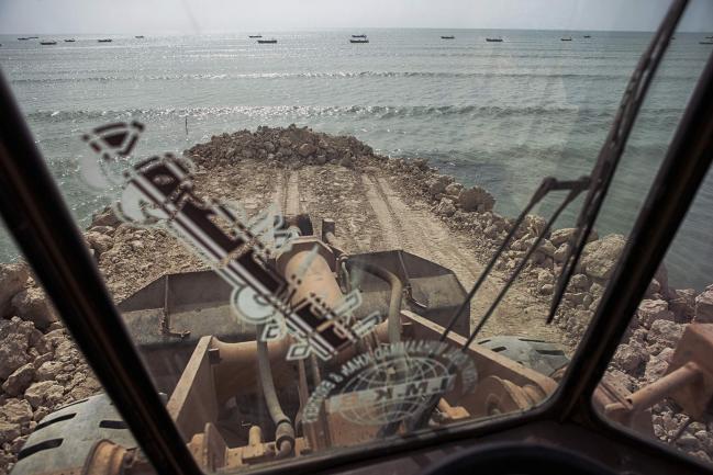 © Bloomberg. A bulldozer operates on a development site at Marine Drive in Gwadar, Balochistan, Pakistan, on Wednesday, Aug. 3, 2016. Gwadar is the cornerstone of Chinese President Xi Jinping's so-called One Belt, One Road project to rebuild the ancient Silk Road, a trading route connecting China to the Arabian Sea that slices through the Himalayas and crosses deserts and disputed territory to reach this ancient fishing port, about 500 miles by boat from Dubai.