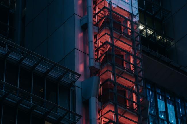 © Bloomberg. A staircase at the HSBC Holdings Plc headquarters building is illuminated in red light at night in Hong Kong, China, on Sunday, July 30, 2017. HSBC is set to announce plans to buy back $2 billion of shares when it unveils second-quarter results on July 31, the Sunday Times reported, without saying where it got the information. Photographer: Anthony Kwan/Bloomberg