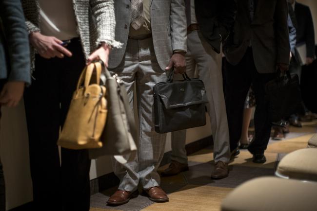 © Bloomberg. Job seekers stand in a line for an interview at the San Francisco Career Fair. Photographer: David Paul Morris/Bloomberg