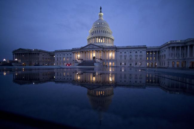 © Bloomberg. The U.S. Capitol is reflected in a Capitol Visitor Center fountain in Washington, D.C., U.S. Photographer: Andrew Harrer/Bloomberg