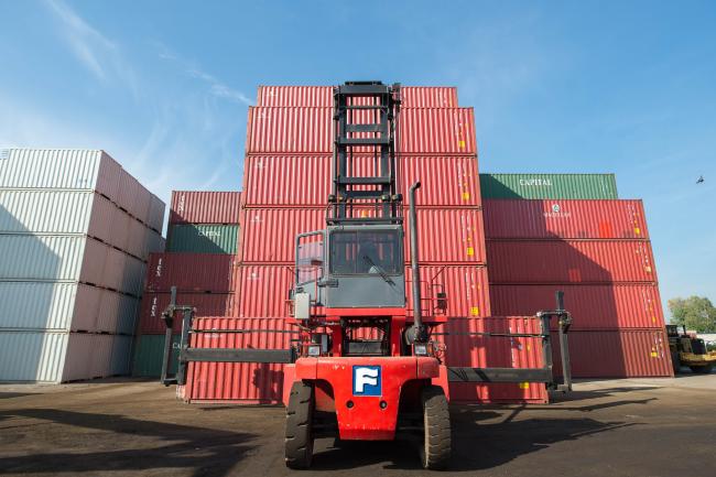 © Bloomberg. A lift moves shipping containers at the Storstac Inc. modification facility in Etobicoke, Ontario, Canada, on Monday, Sept. 25, 2017. Storstac fabricates shipping containers into business and housing units, as Toronto sits among the cities most at risk of a housing bubble while economic optimism and low borrowing costs push up property values in urban areas. Photographer: James MacDonald/Bloomberg