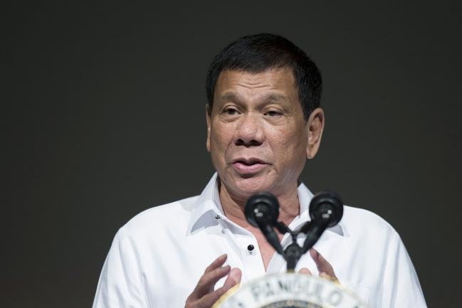 © Bloomberg. Rodrigo Duterte, the Philippines' president, speaks during the Philippine Economic Forum hosted by the Japan External Trade Organization (JETRO) in Tokyo, Japan, on Wednesday, Oct. 26, 2016. Duterte said he wanted all foreign troops out of the Philippines in two years as he continued his tirades against the U.S. during his three-day visit in Japan, a key American ally.