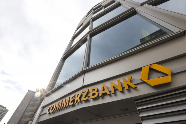 © Bloomberg. A logo sits on the exterior of the Commerzbank AG headquarters following the bank's full year earnings news conference in Frankfurt, Germany, on Thursday, Feb. 14, 2019. Commerzbank on Thursday surprised investors with a better-than-expected profit, but the lender had to scale back an ambitious growth target, citing a “challenging macro environment.” 