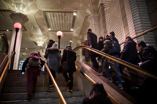 © Bloomberg. Commuters exit a Wall Street subway station near the New York Stock Exchange (NYSE) in New York, U.S., on Monday, March 11, 2019. U.S. stocks bounced back from the worst week of the year, as chipmakers rallied on deal news and the latest retail-sales data boosted confidence that the economy isn't headed for a downturn. 