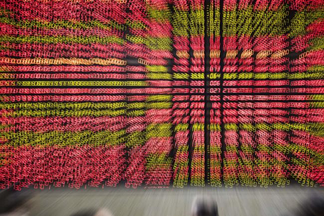 &copy Bloomberg. Stock information is displayed on an electronic board at a securities brokerage in Shanghai, China.