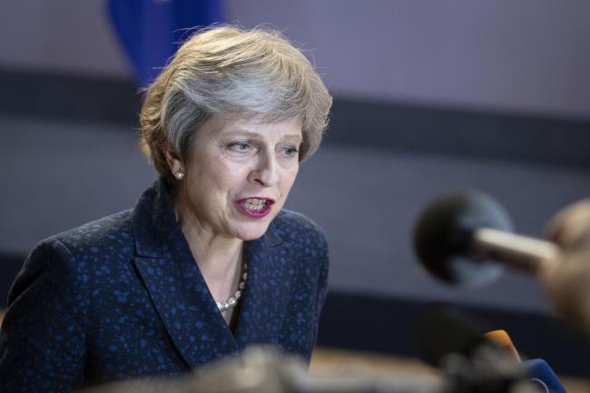 © Bloomberg. Theresa May, U.K. prime minister, speaks to the media as she departs following a European Union (EU) leaders summit in Brussels, Belgium, on Friday, June 29, 2018. 