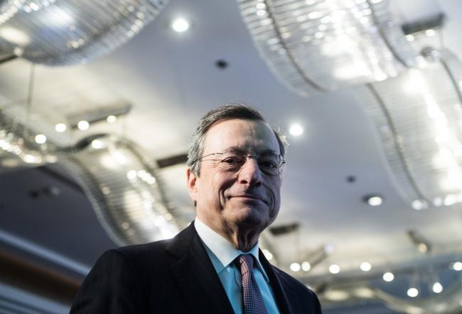 © Bloomberg. Mario Draghi, president of the European Central Bank (ECB), looks on during the 'ECB and its Watchers' conference in Frankfurt, Germany, on Wednesday, March 27, 2019. Some ECB officials have warned in recent months that keeping interest rates below zero for longer than planned as it may at some point prevent the stimulus from reaching the economy because they're hurting bank profitability. Photographer: Andreas Arnold/Bloomberg