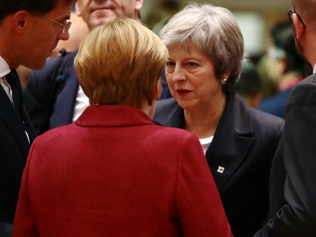 © Bloomberg. Britain's Prime Minister Theresa May (C-R) speaks with (L-R) Netherlands' Prime Minister Mark Rutte, German Chancellor Angela Merkel and Belgian Prime Minister Charles Michel at the European Council during the start of the two day EU summit on December 13, 2018 in Brussels, Belgium.  