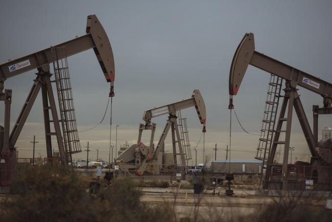 © Bloomberg. Pump Jacks extract crude oil from oil wells in Midland, Texas, U.S., on Monday, Dec. 17, 2018. Once the shining star of the oil business, gasoline has turned into such a drag on profits that U.S. refiners could be forced to slow production in response. Photographer: Angus Mordant/Bloomberg