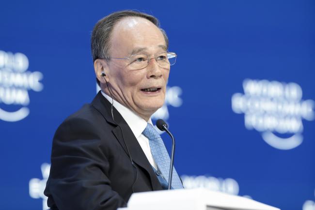 © Bloomberg. Wang Qishan speaks in Davos on Jan. 23. Photographer: Jason Alden/Bloomberg