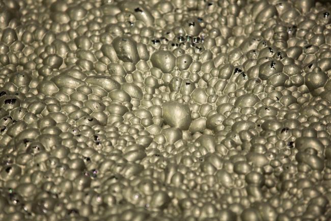 © Bloomberg. Copper flotation foam bubbles inside a machine at the Talnakh concentrator plant, operated by MMC Norilsk Nickel PJSC, in Norilsk, Russia, on Wednesday, Oct. 18, 2017. Norilsk Nickel, which mines the rich deposits of nickel, copper and palladium near Norilsk, has spent 2.5 billion rubles ($40 million) to lay fiber-optic cabling in the Siberian tundra. Photographer: Andrey Rudakov/Bloomberg