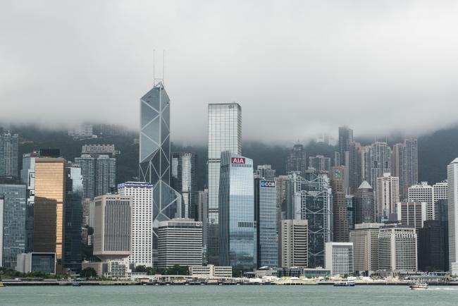 © Bloomberg. The AIA Central building, home to the headquarters of AIA Group Ltd., center, stands among other skyscrapers in the business district of Central in Hong Kong, China, on Thursday, July 23, 2015.
